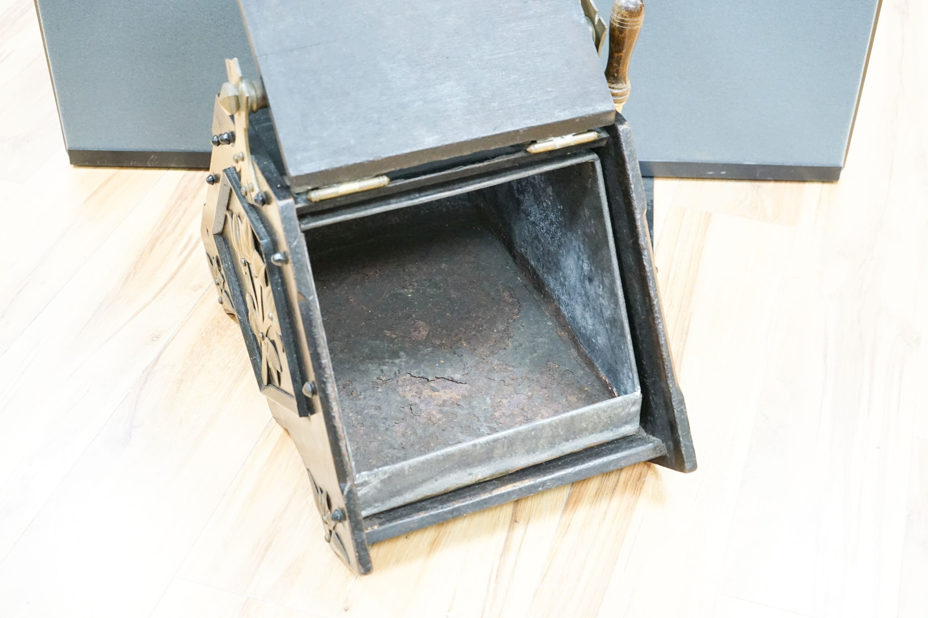 A Victorian Christopher Dresser design brass mounted ebonised coal scuttle, manufactured by Benham & Froud, 40 cm wide